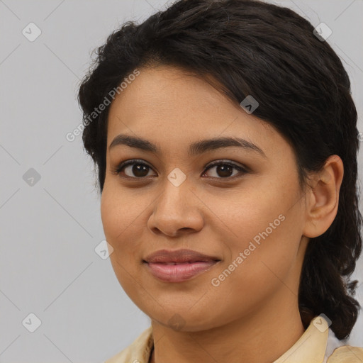 Joyful latino young-adult female with medium  brown hair and brown eyes