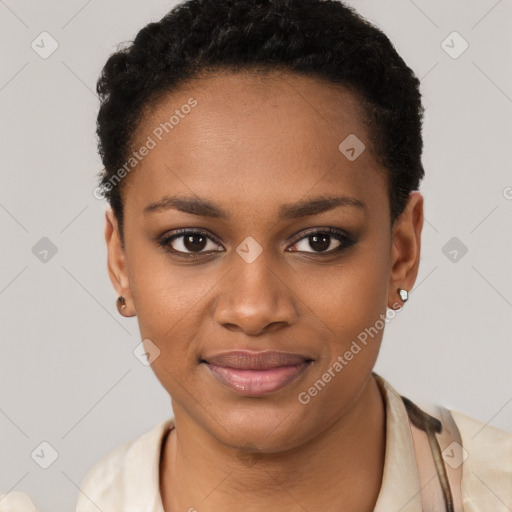 Joyful black young-adult female with short  black hair and brown eyes