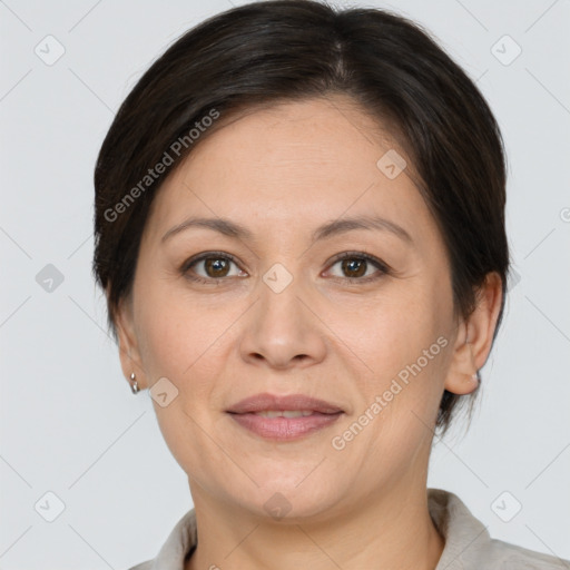 Joyful white adult female with medium  brown hair and brown eyes