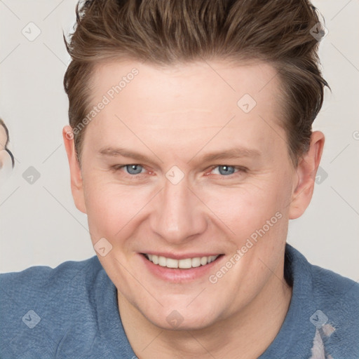 Joyful white adult male with short  brown hair and grey eyes