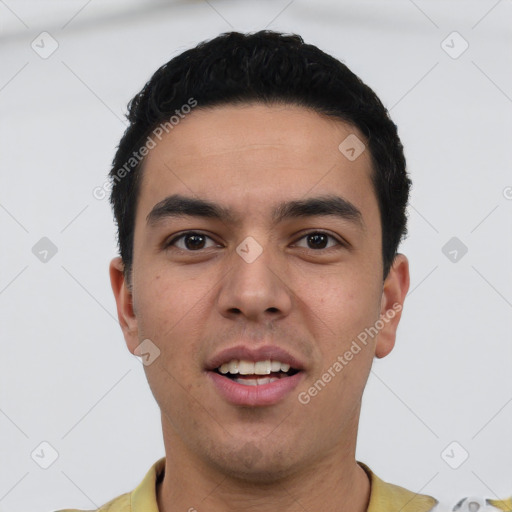 Joyful latino young-adult male with short  black hair and brown eyes