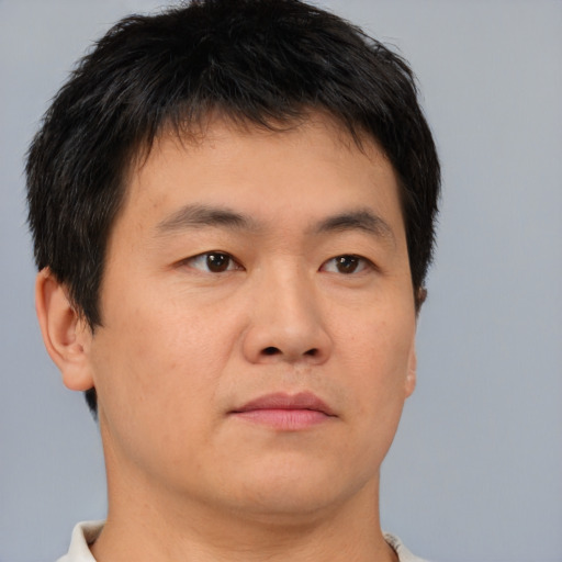 Neutral asian young-adult male with short  brown hair and brown eyes