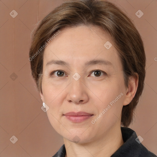 Joyful white adult female with medium  brown hair and brown eyes