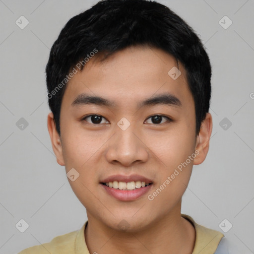 Joyful asian young-adult male with short  black hair and brown eyes