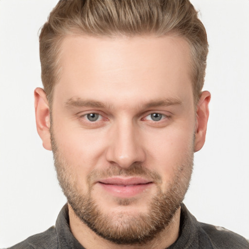 Joyful white adult male with short  brown hair and grey eyes