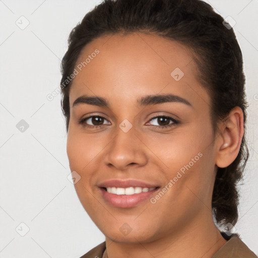 Joyful latino young-adult female with medium  brown hair and brown eyes