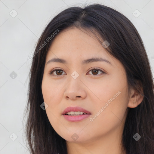 Joyful asian young-adult female with long  brown hair and brown eyes