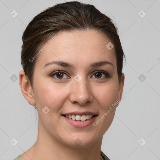 Joyful white young-adult female with medium  brown hair and grey eyes