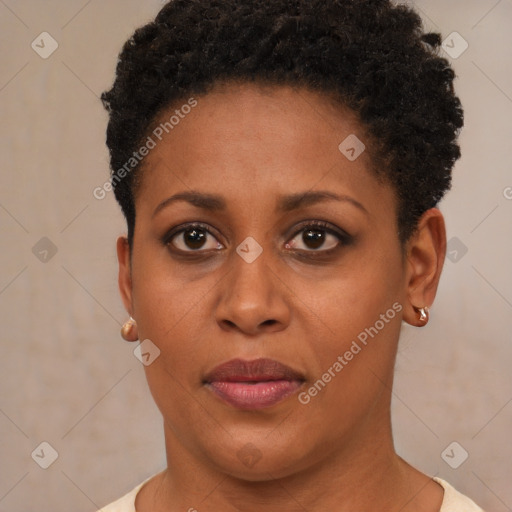 Joyful black young-adult female with short  brown hair and brown eyes