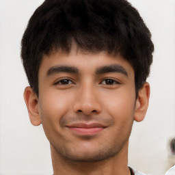 Joyful latino young-adult male with short  brown hair and brown eyes