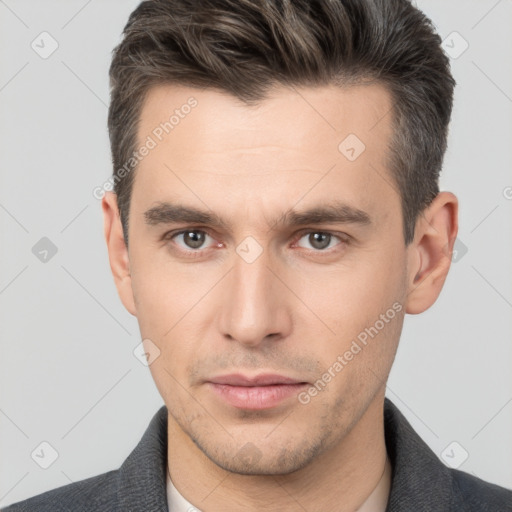 Neutral white young-adult male with short  brown hair and brown eyes