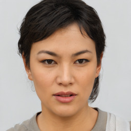 Neutral asian young-adult female with medium  brown hair and brown eyes