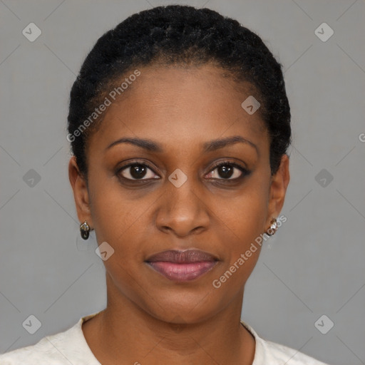 Joyful black young-adult female with short  black hair and brown eyes