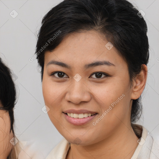 Joyful asian young-adult female with medium  brown hair and brown eyes