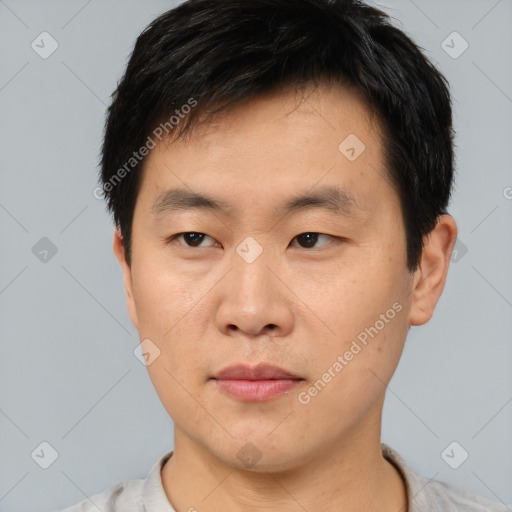 Neutral asian young-adult male with short  black hair and brown eyes