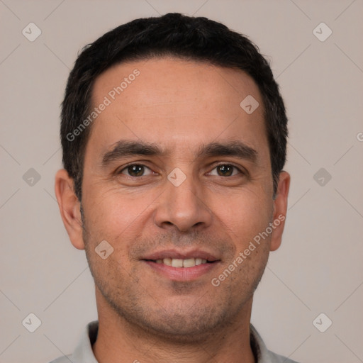 Joyful white young-adult male with short  black hair and brown eyes