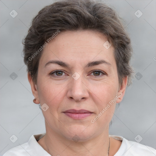 Joyful white adult female with short  brown hair and grey eyes