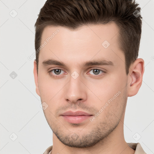 Neutral white young-adult male with short  brown hair and brown eyes