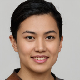 Joyful asian young-adult female with short  brown hair and brown eyes