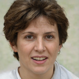 Joyful white adult female with short  brown hair and brown eyes