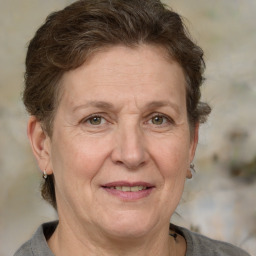 Joyful white middle-aged female with short  brown hair and brown eyes