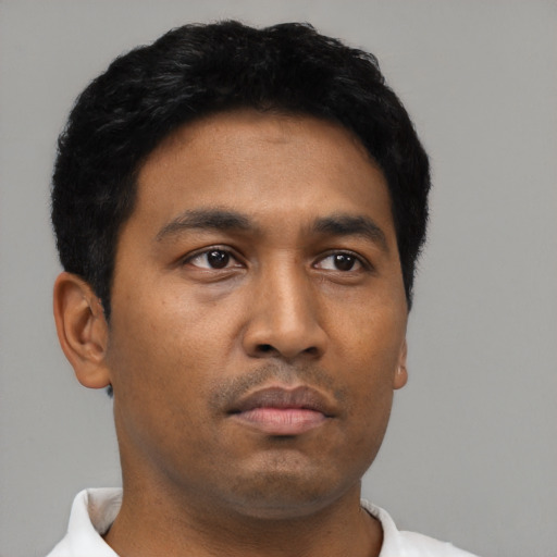 Neutral latino young-adult male with short  black hair and brown eyes