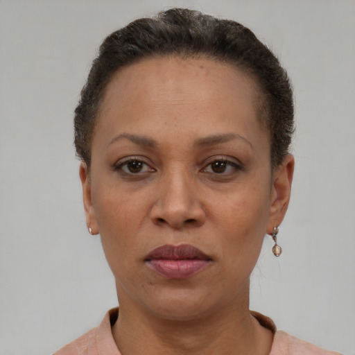 Neutral black adult female with short  brown hair and brown eyes