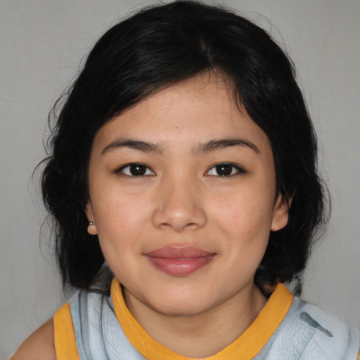 Joyful asian young-adult female with medium  black hair and brown eyes