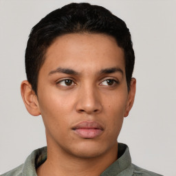 Neutral latino young-adult male with short  black hair and brown eyes