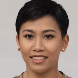 Joyful asian young-adult female with short  black hair and brown eyes