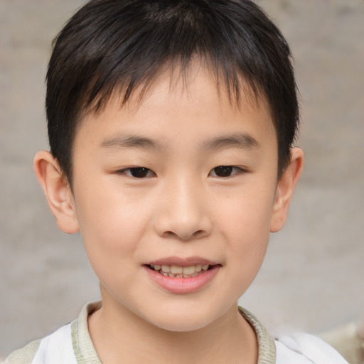 Joyful asian child male with short  brown hair and brown eyes