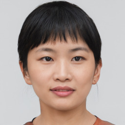 Joyful asian young-adult female with short  black hair and brown eyes