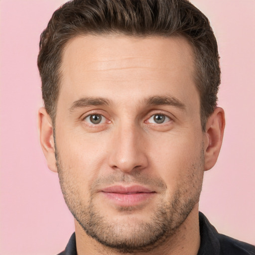 Joyful white young-adult male with short  brown hair and brown eyes