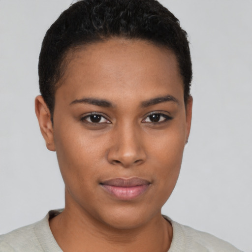 Joyful black young-adult female with short  brown hair and brown eyes