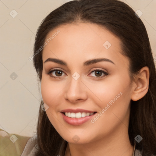 Joyful white young-adult female with long  brown hair and brown eyes