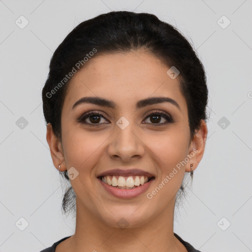 Joyful latino young-adult female with short  brown hair and brown eyes