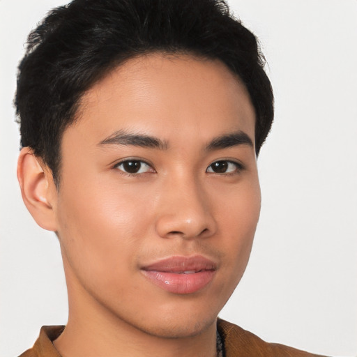 Joyful asian young-adult male with short  brown hair and brown eyes