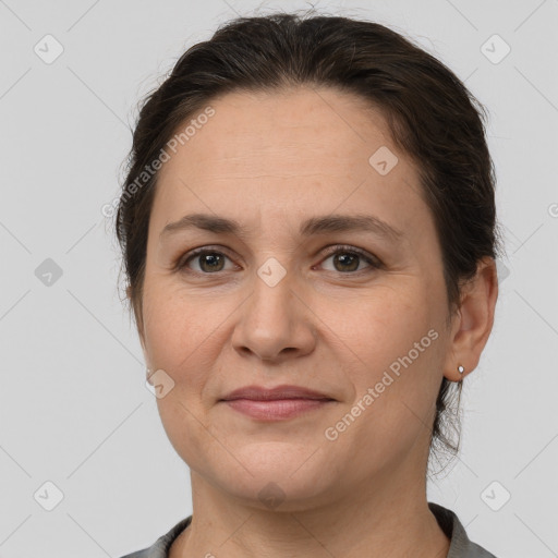 Joyful white adult female with short  brown hair and brown eyes