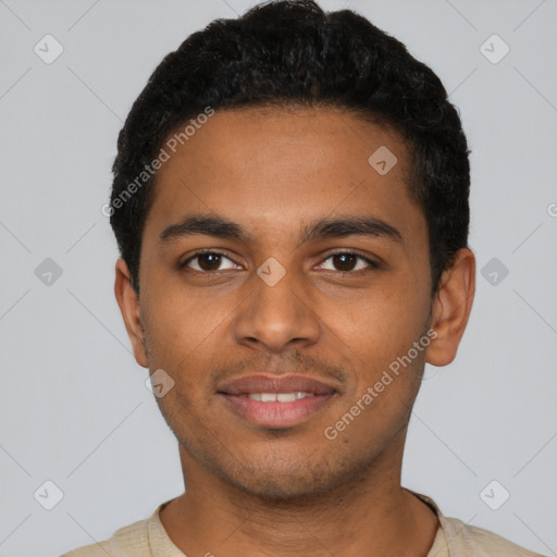 Joyful black young-adult male with short  black hair and brown eyes