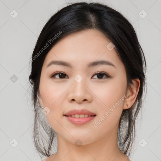 Joyful asian young-adult female with long  brown hair and brown eyes