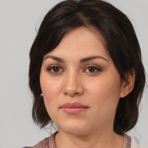 Neutral white young-adult female with medium  brown hair and brown eyes