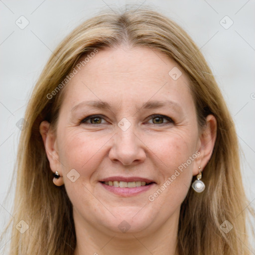 Joyful white adult female with long  brown hair and grey eyes