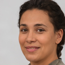 Joyful white adult female with short  brown hair and brown eyes