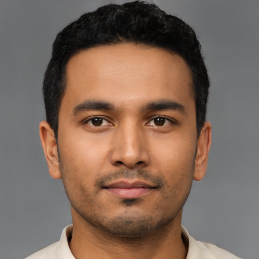 Neutral latino young-adult male with short  black hair and brown eyes