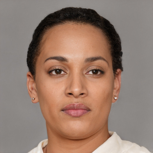 Neutral latino young-adult female with short  brown hair and brown eyes