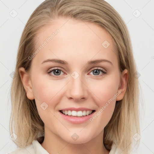 Joyful white young-adult female with long  brown hair and blue eyes