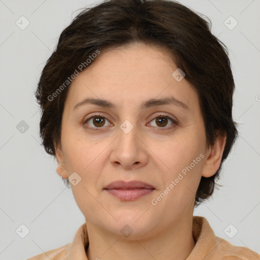 Joyful white adult female with medium  brown hair and brown eyes