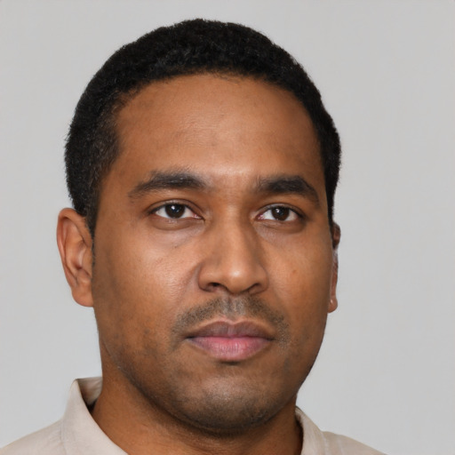 Neutral black young-adult male with short  black hair and brown eyes