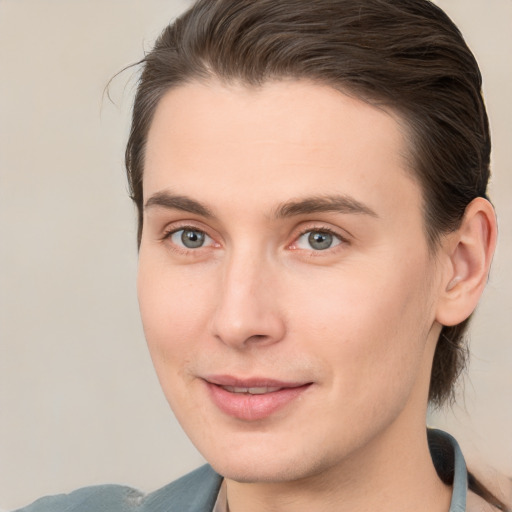 Joyful white young-adult male with medium  brown hair and brown eyes