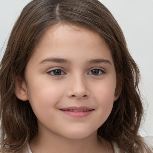 Joyful white child female with long  brown hair and brown eyes